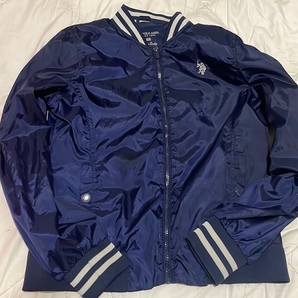 Navy blue U.S Polo Assn. puffer jacket with pockets